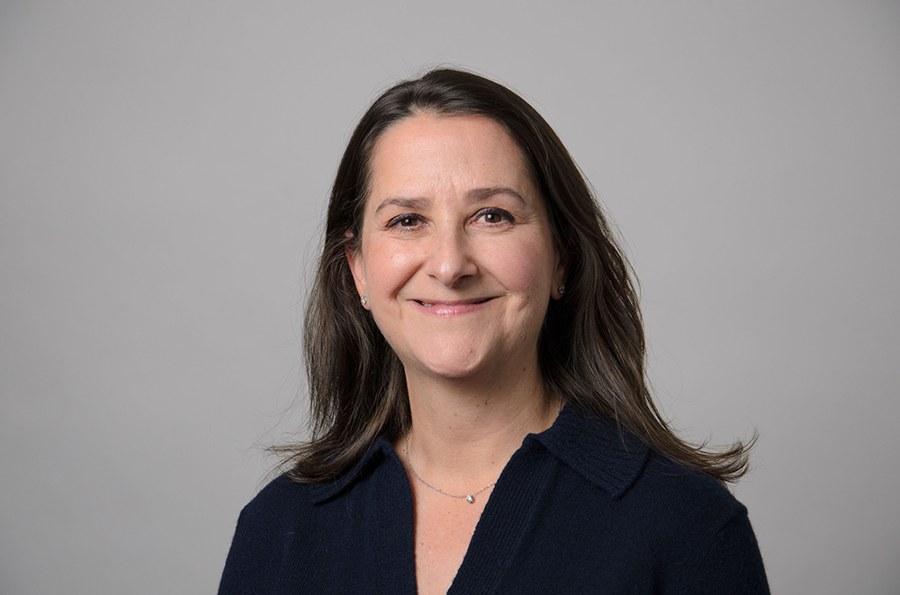 Portrait of Lauren Rosenkranz wearing a dark blue sweater.